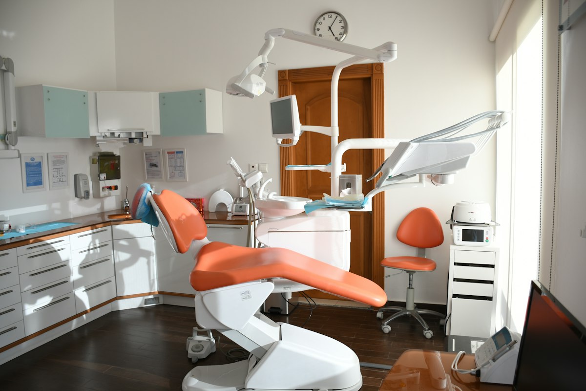 A comfortable dental chair in a calm, sunlit room