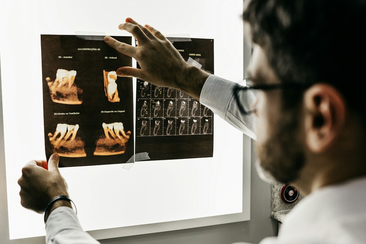 A dentist reviewing a dental x-ray